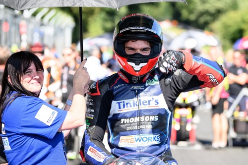 Thumbs down from an unwell Kam Dixon on the grid at Cadwell.