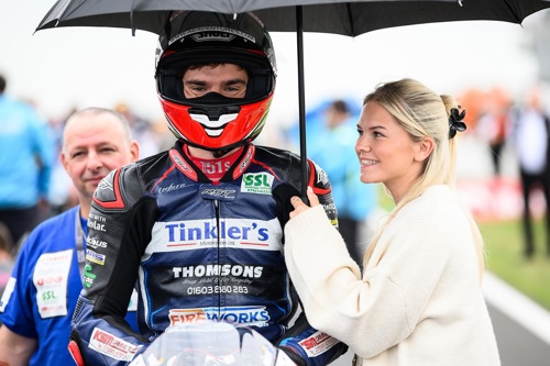 Kam on the grid with a smiling Chelsy.